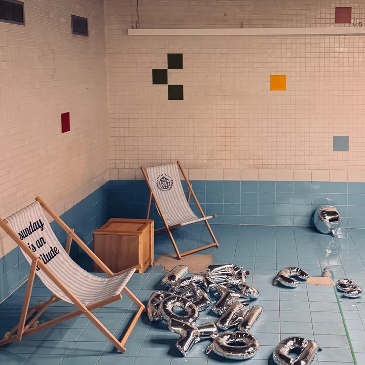 Sunday is an attitude deck chairs and silver balloons