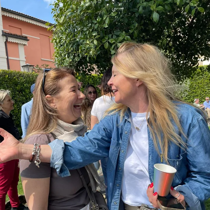 Two friends laughing in the garden