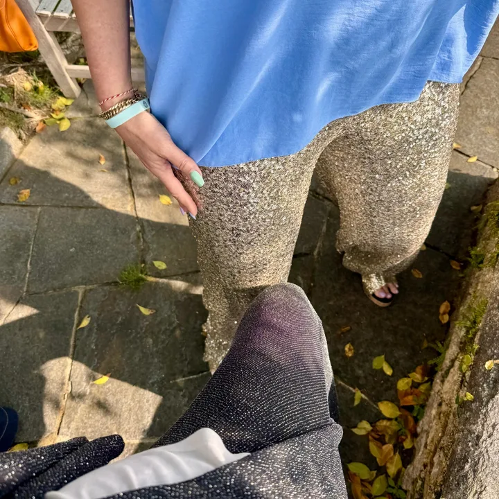 Sequin trousers and blue top in the sun